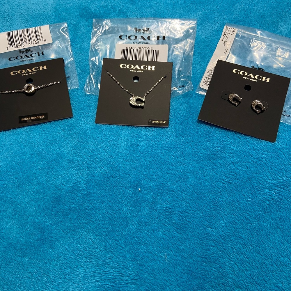 Coach brand new jewelry set. Necklace, earring and bracelet set. - Picture 1 of 11
